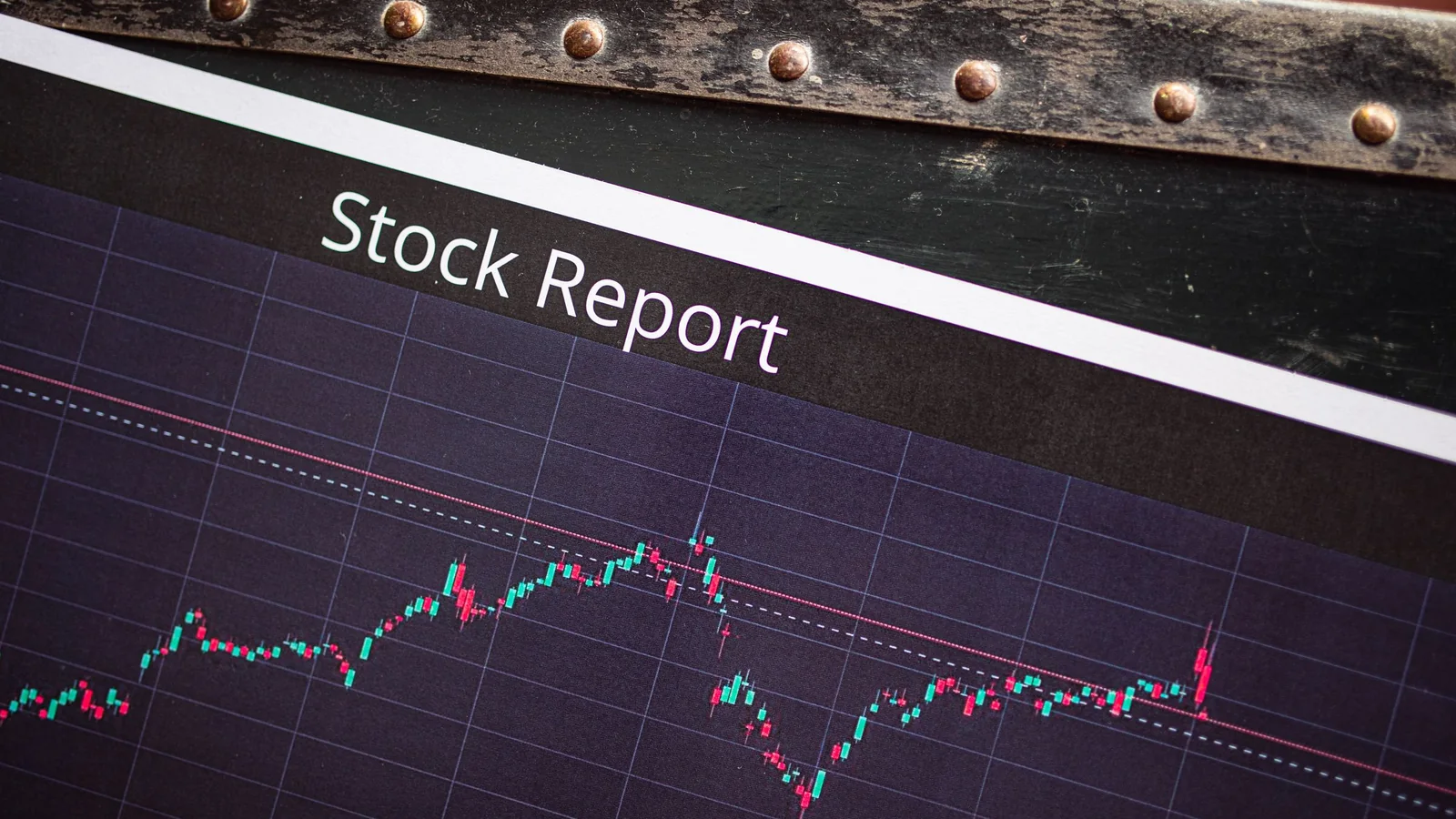 A printed stock report with a market performance graph