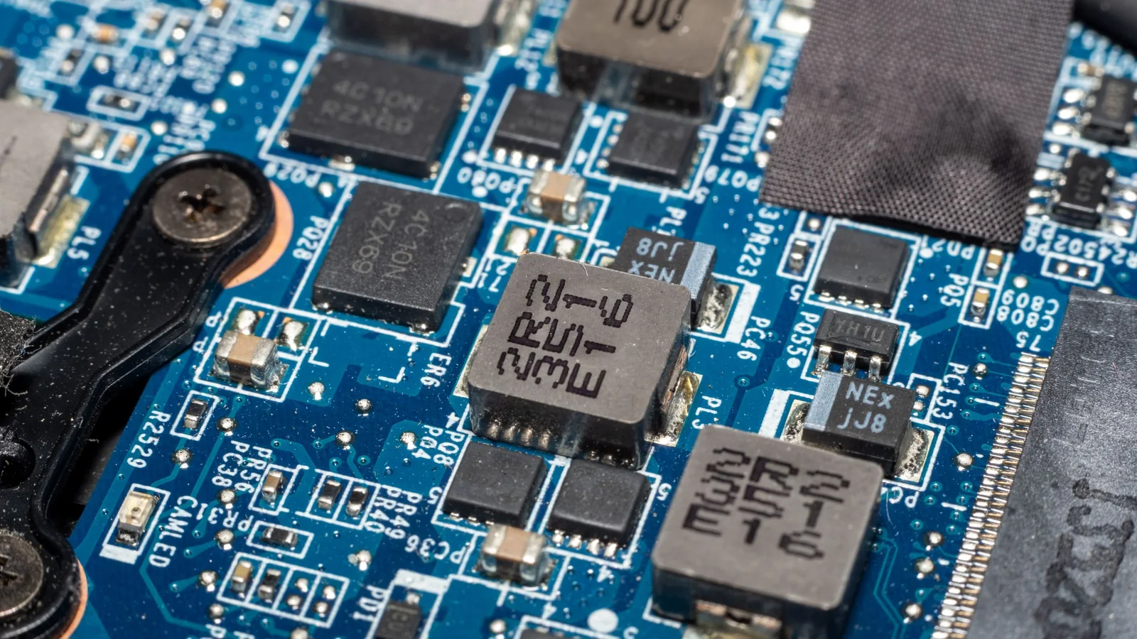 Close-up of chips and components on a blue circuit board